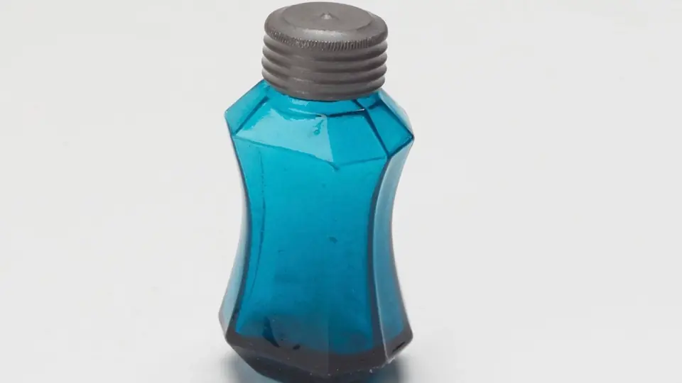 Parfumflesje in het licht